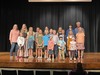 Back row (L to R): Tracy Bean (piano teacher), Lauren Caldwell, Lyla Scott, Marissa Brewer, Maren Cunningham, Rolli Wolf, Ian McKee, Bruce Wolf
Middle row (L to R): Hayes Scott, Harper Wolf, Malin Frickenschmidt, Ardrew Hedeman, Nathaniel Fittje, Eli Fittje, Tripp Wolf, Boston Frickenschmidt, Molly Hedeman 
Front row (L to R): Dax Frickenschmidt (emcee), James Fittje (conductor and piano student), and Addie Strong (conductor)