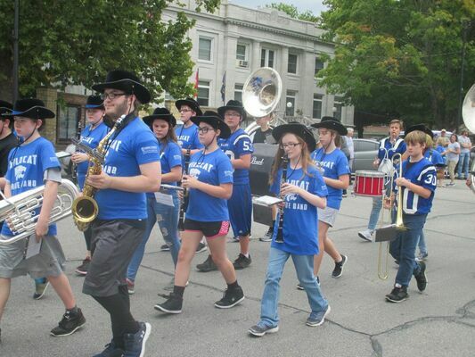 The GHS band marches around the square.