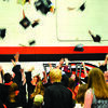 The graduates celebrate with a cap toss.