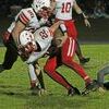 Miller’s Nick Johnson, #5, pushes forward while Clay Allen, #74, helps to shake the tackle. (Photo by Gina Langston)