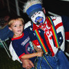Wild Wayne West, the clown, visits with 4-year-old Eli McWilliams of Lamar, the great-nephew of Bryan and Robin Stewart.