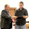 Cory Webb, right, receives his plaque from Honorable David Munton.