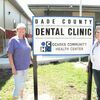 Greenfield Chamber of Commerce President Kim Rhodes and Health Department Administrator Pam Allen flank the sign for the new dental clinic, sponsored by the Dade County Health Department, opening in mid-October after being several years in the making. (Photo by James McNary)