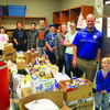 Greenfield students and Mr. Dobson with the food pantry donation inside at OACAC.