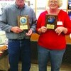 Brad VanHooser, left and Vickie Blakemore receive plaques honoring their achievement.