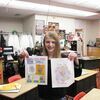 Lockwood sixth-grader Hanna Jackson holds her winning design as well as a copy of the announcement that her sketch will be the basis of a design being featured on a run of Earth Day t-shirts.